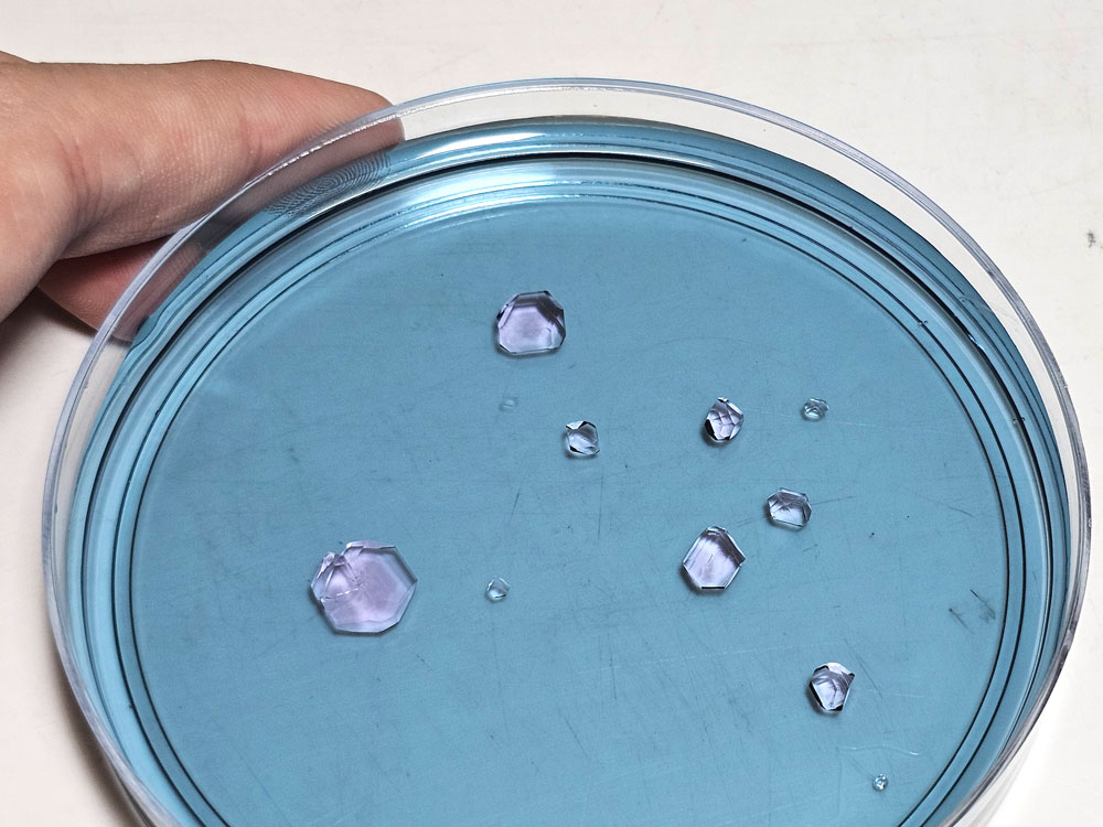 Small purple alum seed crystals.