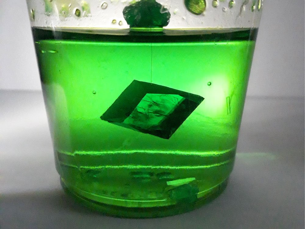 potassium ferrioxalate crystal grown from a saturated solution of oxalic acid