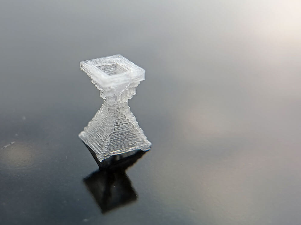 a pyramid salt crystal shaped like an hourglass