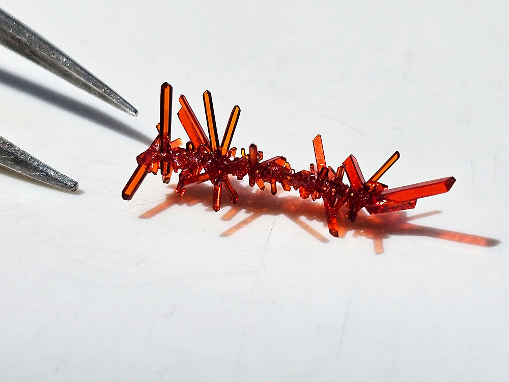 A very small cluster of potassium ferricyanide crystals.